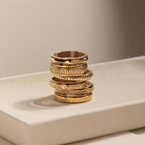 gold spinning cross pattern ring